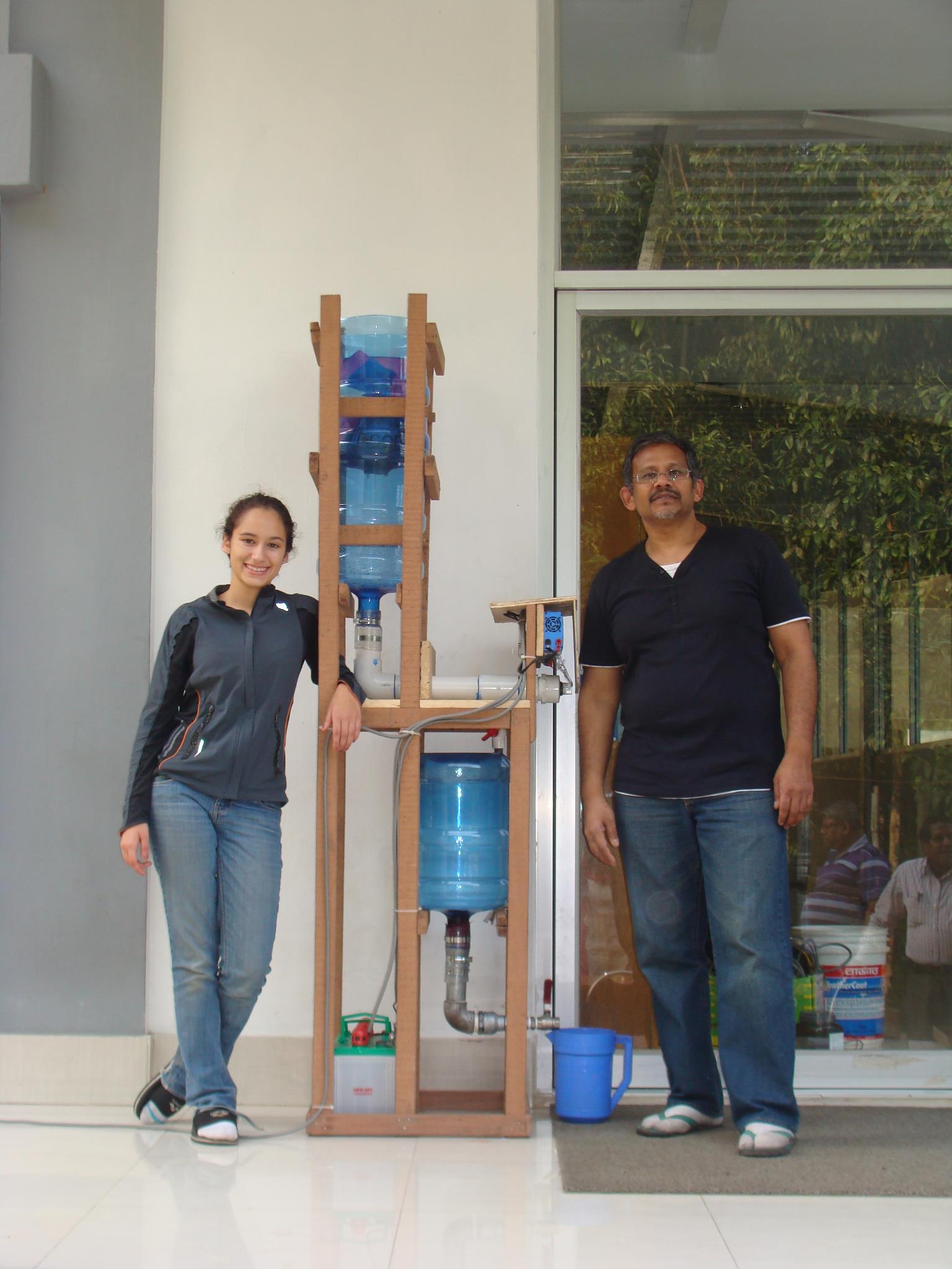 Sabera Talukder building her water purification system in Dhaka, Bangladesh.